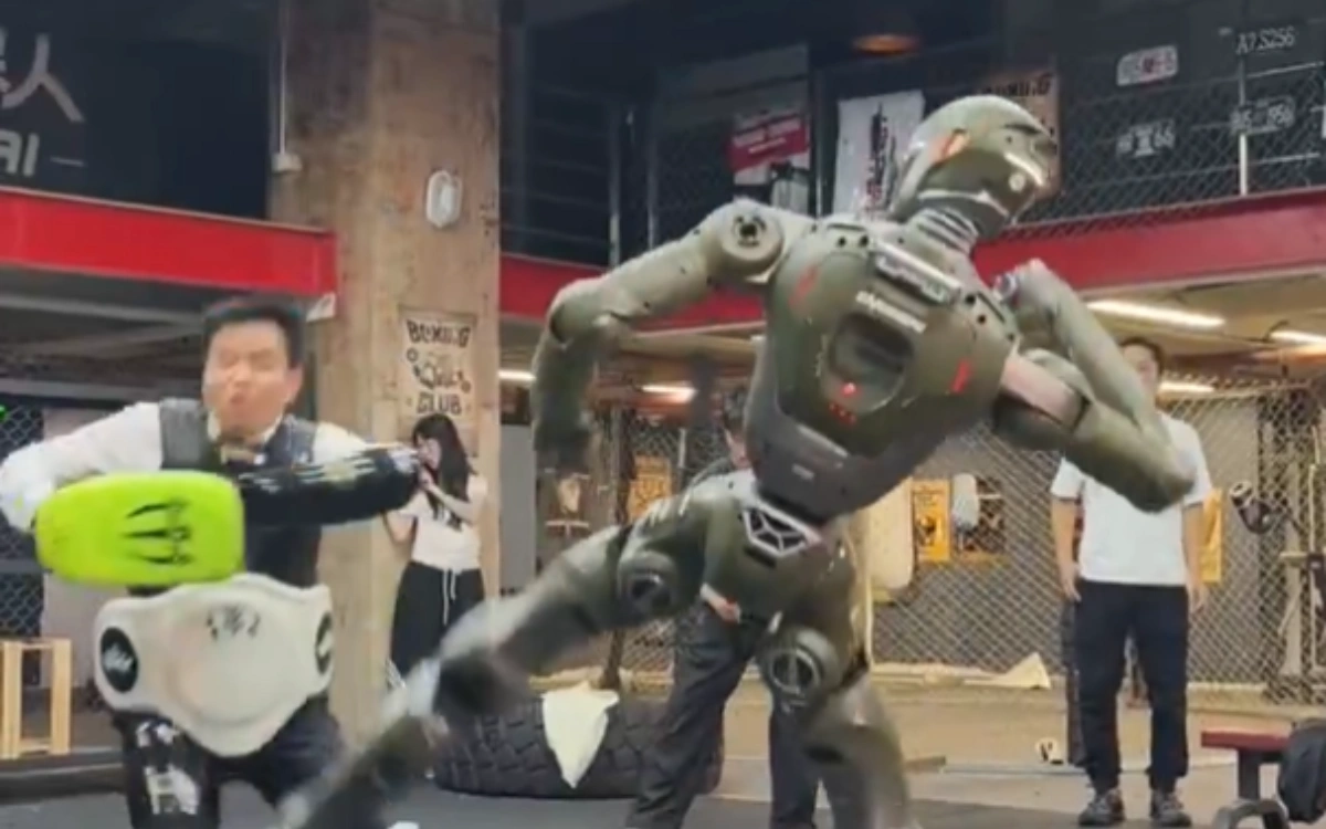 Chinese CEO kicked over by humanoid T800 robot in simulated battle as company seek to make point
