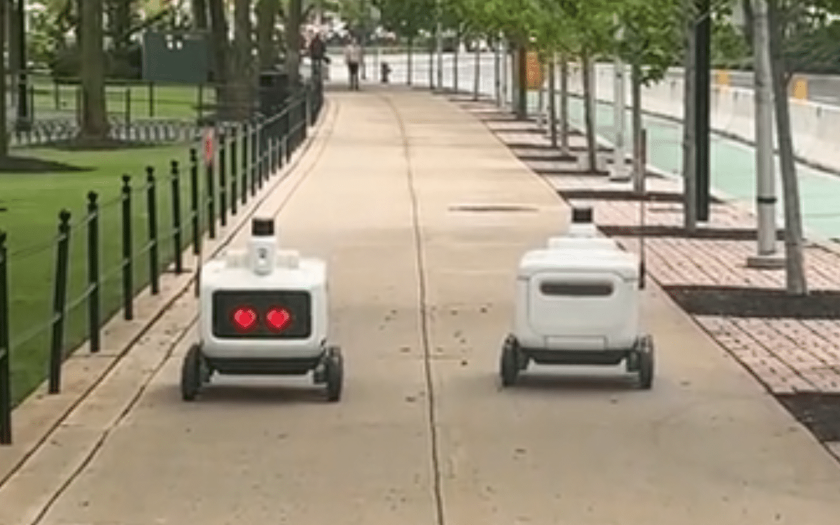 Two robots appear to fall in love when they pass each other in New Jersey