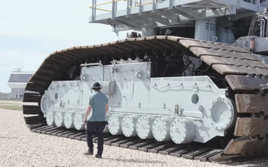Before liftoff, NASA relies on its giant crawler-transporters to haul rocket ships on a journey that is slower than most people walk.