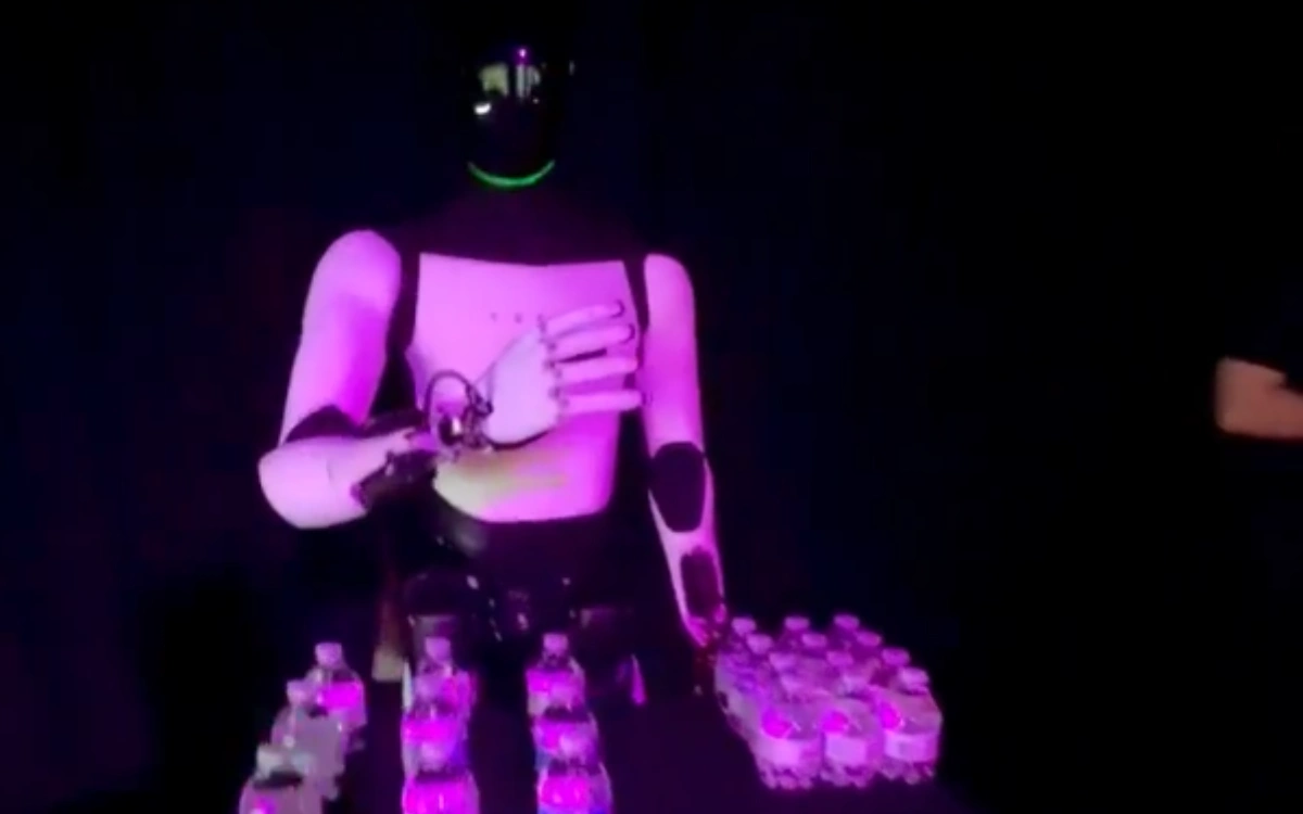 Tesla's Optimus robot shuts down after replicating the gesture of its human operator removing their headset