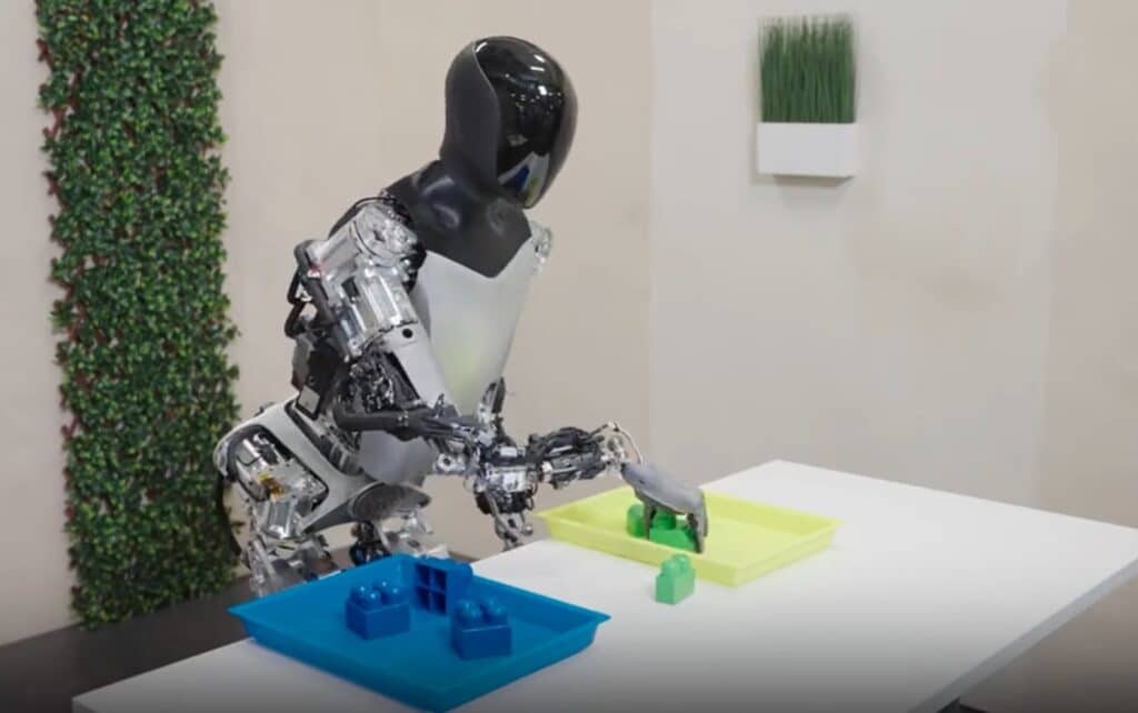 Optimus Tesla bot sorting blocks according to color