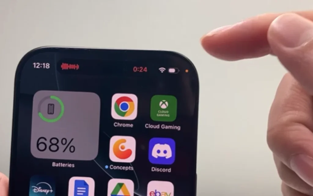 This is what the little orange and green dots mean when they pop up on your iPhone screen