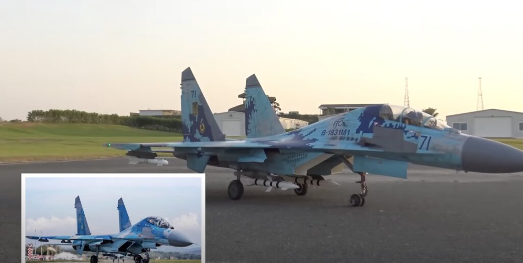 Miniature fighter jet - next to real life jet