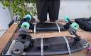 The skateboards are strapped to the bottom.