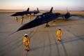 Pilots stand with their spy planes.